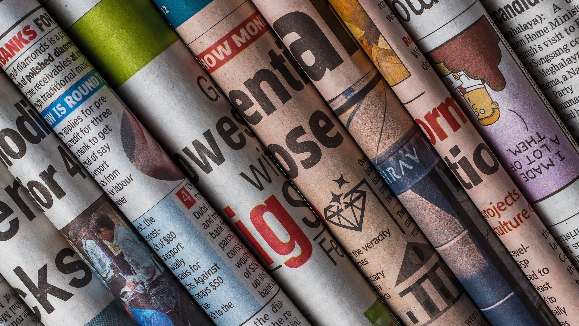 A sanbox with a pail and a shovel