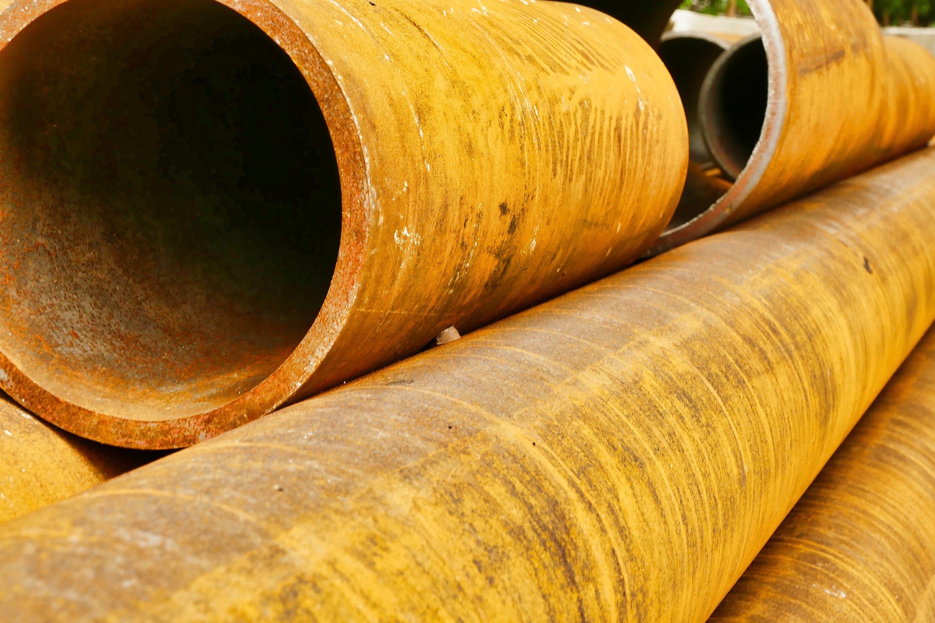 stacked rusty pipes